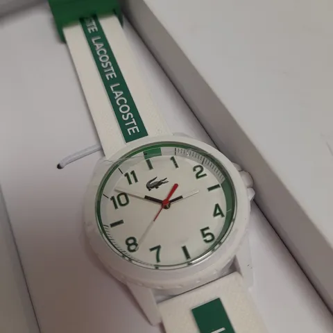 LACOSTE WHITE DIAL WATCH WITH WHITE AND GREEN STRAP DETAIL