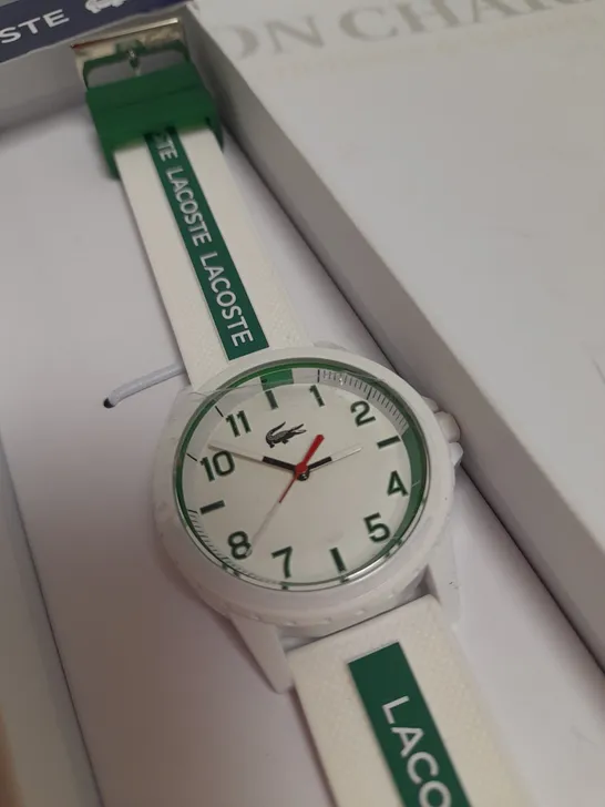 LACOSTE WHITE DIAL WATCH WITH WHITE AND GREEN STRAP DETAIL