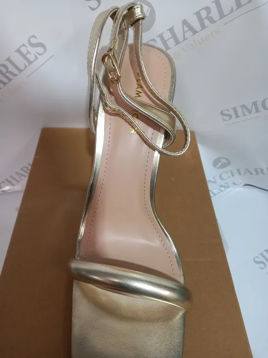 BOXED PAIR OF LADIS GLAMOROUS HEELS IN GOLD SIZE UK7 