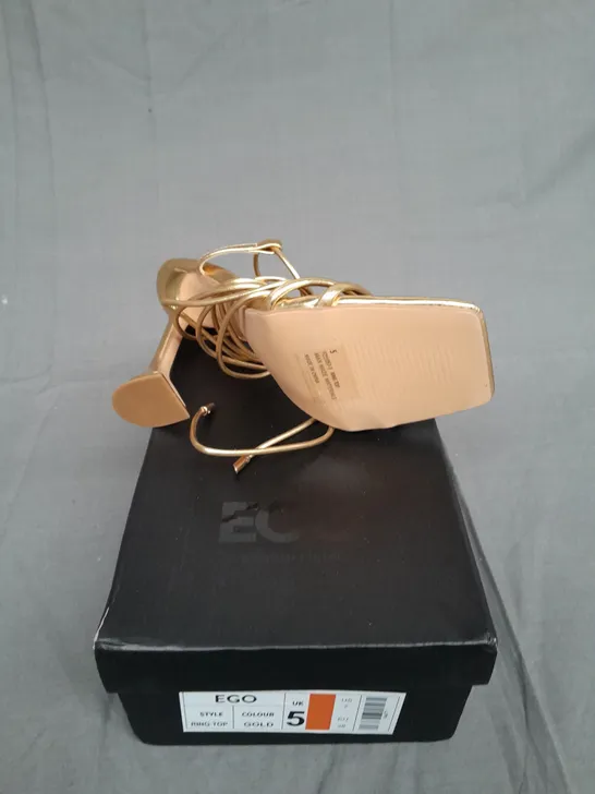 BOXED PAIR OF EGO GOLD HEEL RING TOP SIZE UK 5