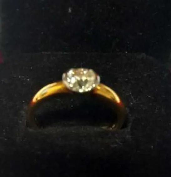 18CT GOLD SOLITAIRE RING SEMI-RUB-OVER-SET WITH A DIAMOND WEIGHING +0.75CT