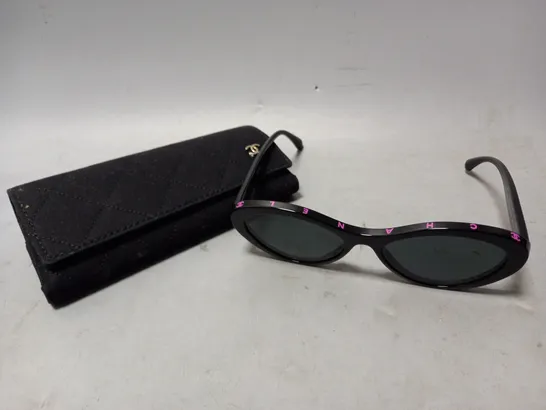 CHANEL OVAL FRAMED SUNGLASSES IN BLACK