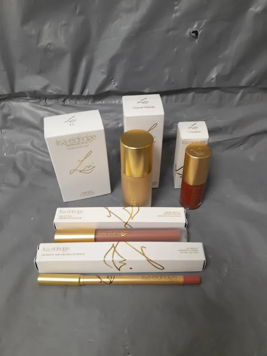 LOT OF 5 LISA ELDRIDGE MAKE UP PRODUCTS TO INCLUDE FOUNDATION, LIP GLOSS AND A LIP PENCIL