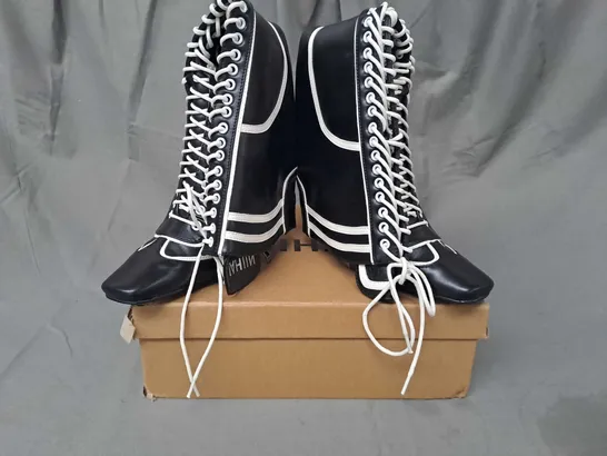 BOXED PAIR OF NIIHAI HEELED BOXER BOOTS IN BLACK/WHITE EU SIZE 36