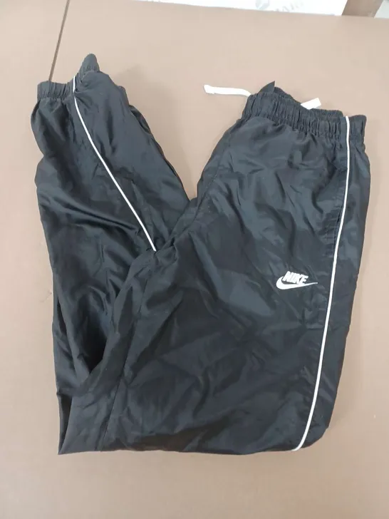 NIKE TRACKSUIT BOTTOMS IN BLACK/WHITE - XS