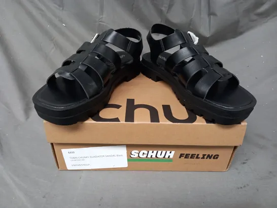 BOXED PAIR OF SCHUH TOBIN CHUNKY GLADIATOR SANDALS IN BLACK SIZE 6