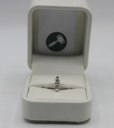 18CT WHITE GOLD SOLITAIRE RING SET WITH A MARQUISE CUT DIAMOND WEIGHING +1.01CT