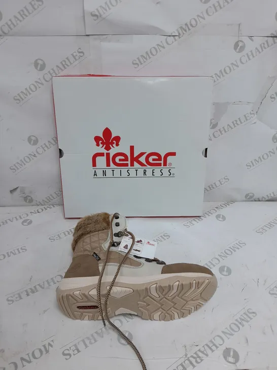 BOXED PAIR OF RIEKER CREAM WINTER FUR HIKE BOOTS IN SIZE 6