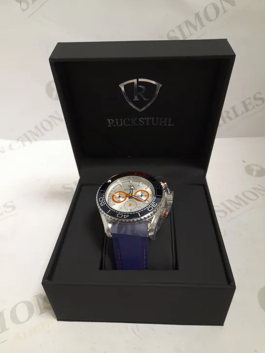 MEN’S RUCKSTUHL CHRONOGRAPH R400 WATCH – SILVER COLOUR CASE – SILVER DIAL – 3ATM WATER RESISTANT – BLUE RUBBER STRAP 