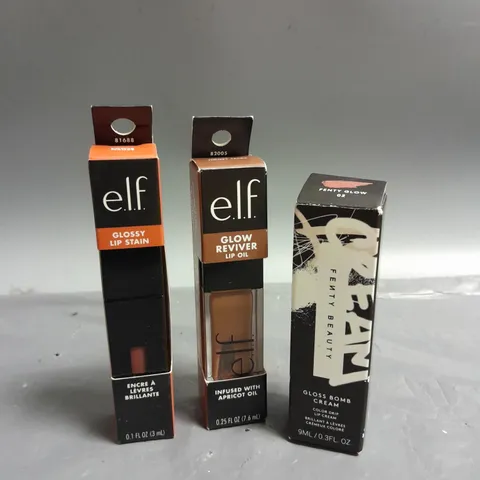 LOT OF 3 COSMETIC PRODUCTS TO INCLUDE - ELF GLOSSY LIP STAIN - ELF GLOW REVIVER LIP OIL - FENTY BEAUTY GLOSS BOMB LIP CREAM