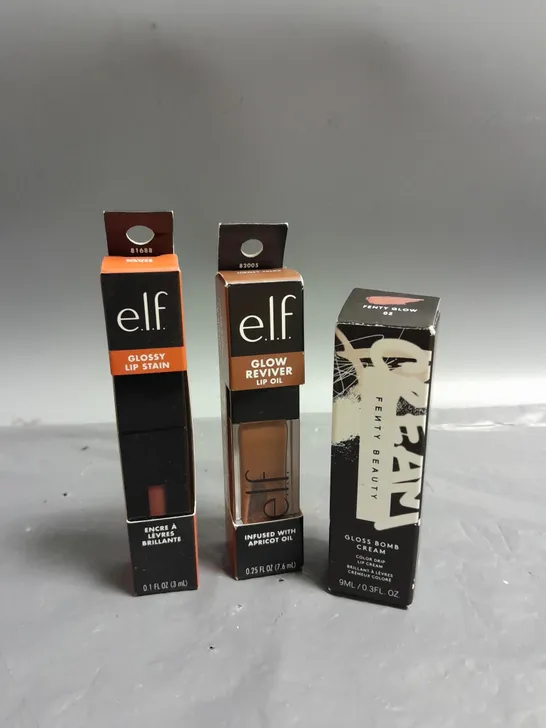 LOT OF 3 COSMETIC PRODUCTS TO INCLUDE - ELF GLOSSY LIP STAIN - ELF GLOW REVIVER LIP OIL - FENTY BEAUTY GLOSS BOMB LIP CREAM