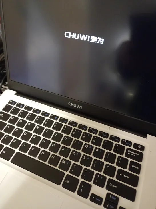 CHUWI WHITE, LAPTOP WITH PINK CASE APPROX. 13.7" SCREEN