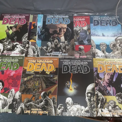 LOT OF 11 THE WALKING DEAD GRAPHIC NOVELS - VOLUMES 2/5/7/9/11/12/15/24/25/27/31