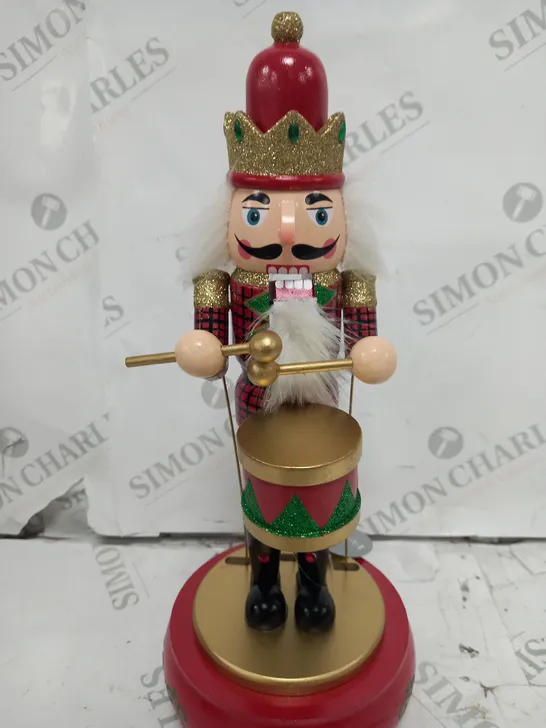 FESTIVE 32CM WOODEN ANIMATED MUSICAL NUTCRACKER