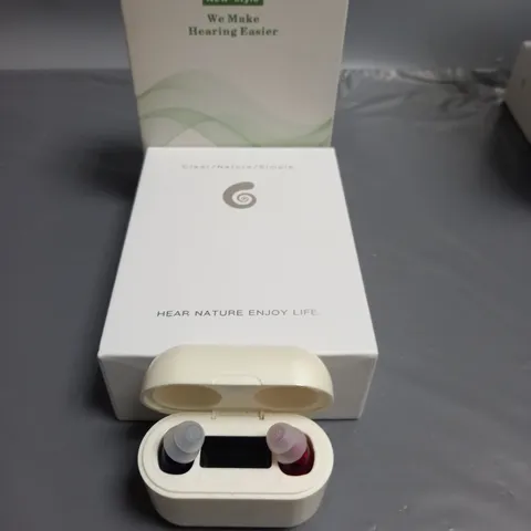 BOXED WE MAKE HEARING EASIER HEARING AID