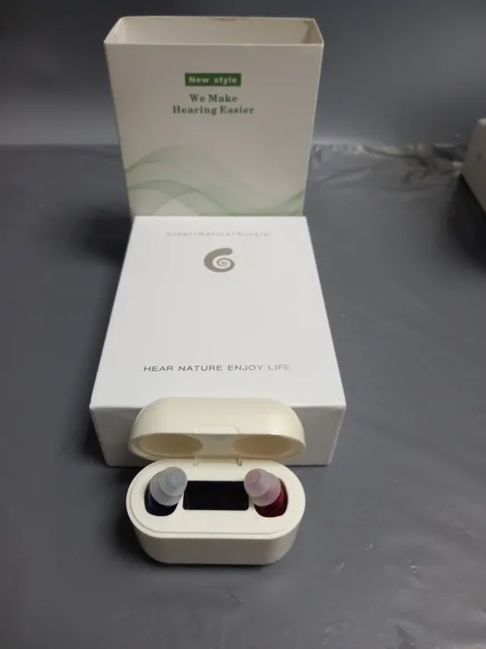 BOXED WE MAKE HEARING EASIER HEARING AID