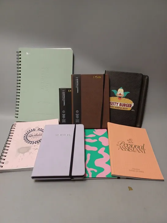 APPROXIMATELY 25 ASSORTED TYPO DIARIES, JOURNALS, NOTEBOOKS TO INCLUDE GARFIELD UNIVERSITY A5 CAMPUS NOTEBOOK, A6 BUFFALO JOURNAL, A4 EVERYDAY NOTEBOOK 