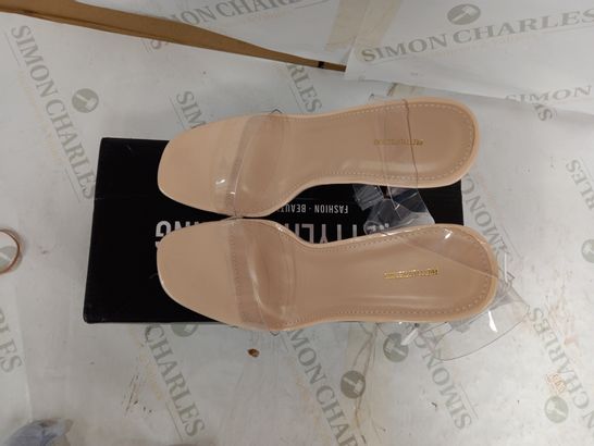 BOXED PAIR OF PRETTYLITTLETHING NUDE FLAT HEEL CLEAR STRAP SANDALS - UK 4