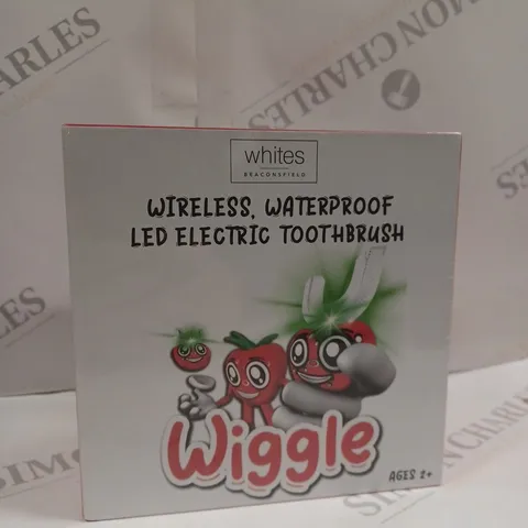 BOXED AND SEALED “WIGGLE” CHILDREN'S ELECTRIC TOOTHBRUSH
