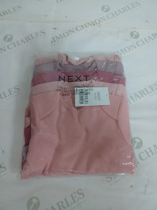 SEALED NEXT BABY SET OF 4 BODY SUITS - 6-9 MONTHS 