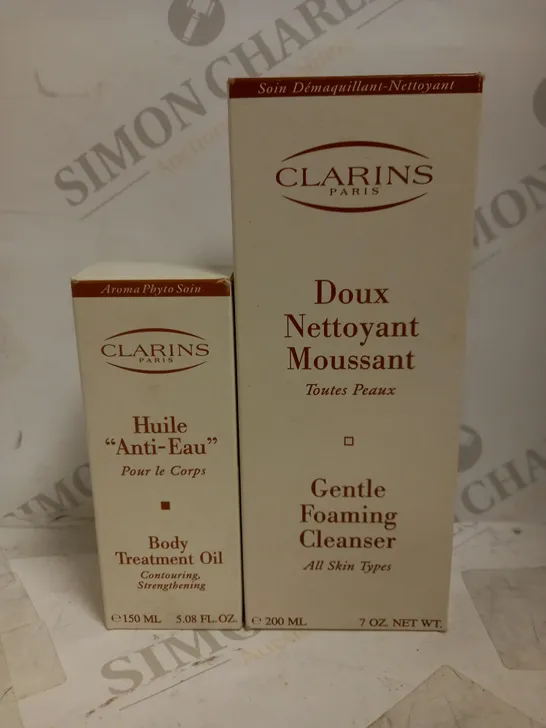 LOT OF 2 ASSORTED CLARINS PRODUCTS TO INCLUDE BODY TREATMENT OIL 150ML & GENTLE FOAMING CLEANSER 200ML