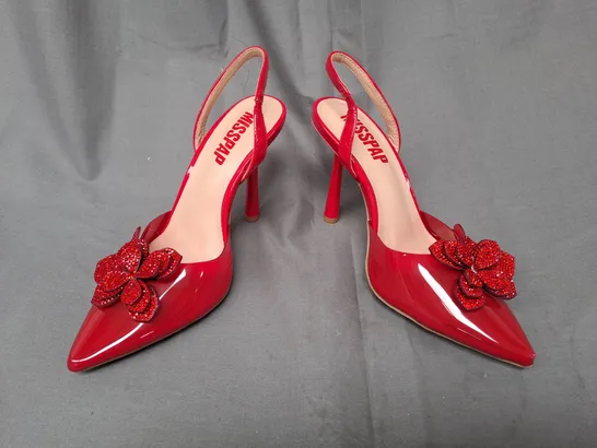 BOXED PAIR OF MISSPAP POINTED TOE HIGH HEEL SANDALS IN RED W. FLORAL DETAIL SIZE 4