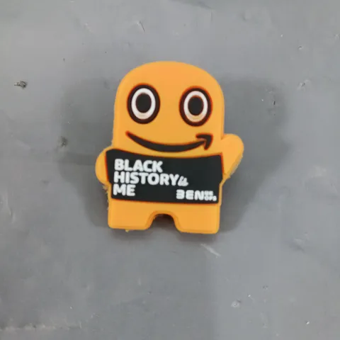 APPROXIMATELY 100 BLACK HISTORY ME BADGES IN ORANGE