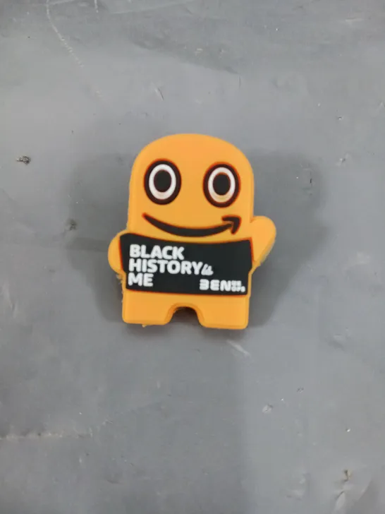 APPROXIMATELY 100 BLACK HISTORY ME BADGES IN ORANGE