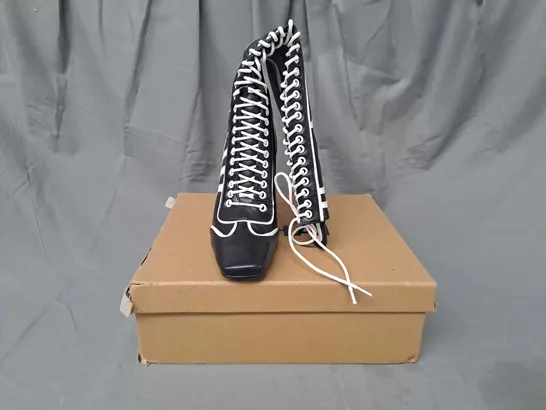 BOXED PAIR OF NIIHAI HEELED BOXER BOOTS IN BLACK/WHITE EU SIZE 36