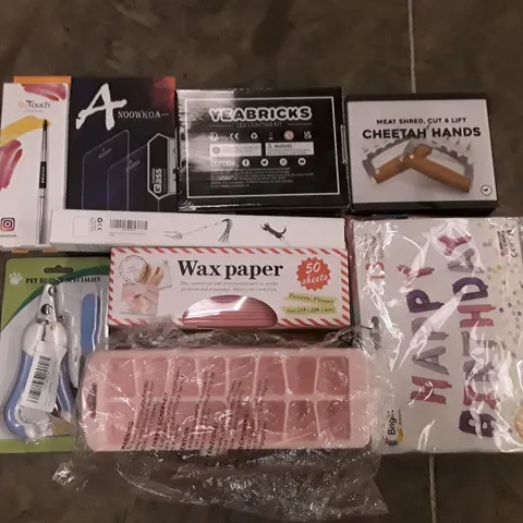 PALLET OF ASSORTED PRODUCTS INCLUDING WAX PAPER, ICE CUBE TRAY, PHONE PROTECTOR, MEAT SHRED CHEETAH HANDS, BIRTHDAY BALLOON, PET CLIPPERS