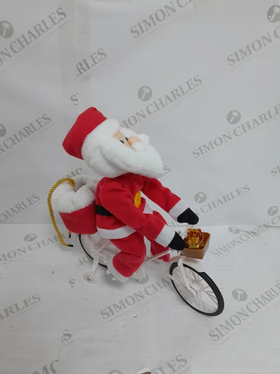 MR CHRISTMAS PRE-LIT MUSICAL CYCLING SANTA