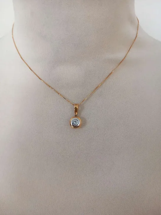 18CT GOLD RUBOVER PENDANT ON A CHAIN , SET WITH A NATURAL DIAMOND