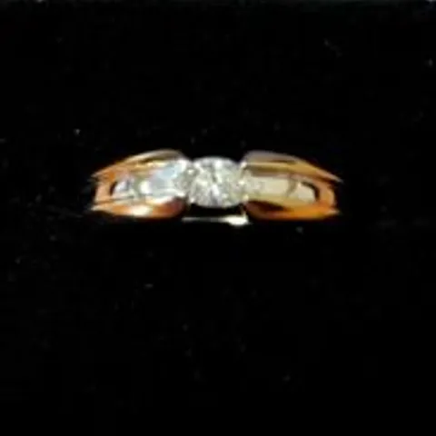 18CT GOLD RING TENSION SET WITH A NATURAL MARQUISE CUT DIAMOND
