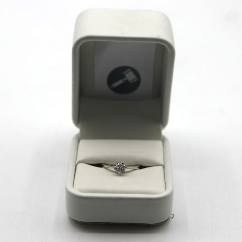 9ct WHITE GOLD SOLITAIRE RING SET WITH A DIAMOND WEIGHING +-0.51ct 