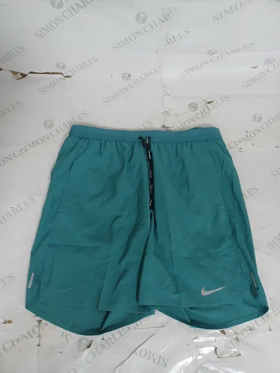 NIKE RUNNING SHORTS IN GREEN SIZE M