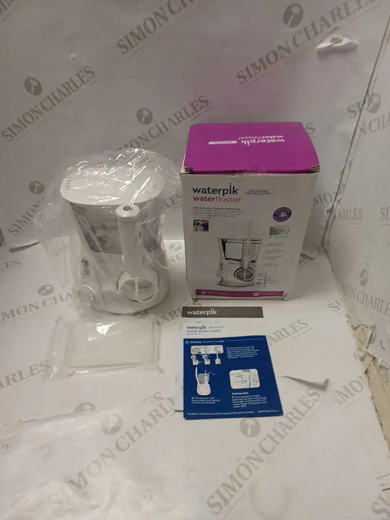 BOXED WATERPIK PROFESSIONAL WHITENING WATER FLOSSER, WITH ACCESSORIES AND INSTRUCTIONS