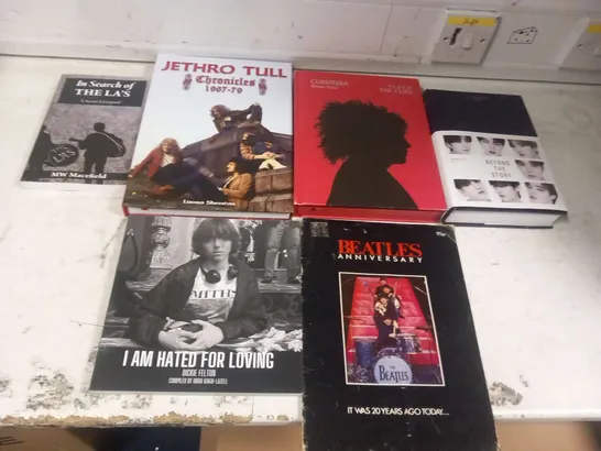 APPROXIMATELY SIX ASSORTED MUSIC BOOKS TO INCLUDE; BEATLES ANNIVERSARY MAGAZINE, JETHRO TULL CHRONICLES 1967-79, CUREPEDIA, BTS BEYOND THE STORY, I AM HATED FOR LOVING DICKIE FELTON AND IN SEARCH OF T