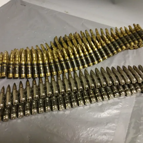 TWO STRIPS OF BULLETS ATTACHED TO BELTS