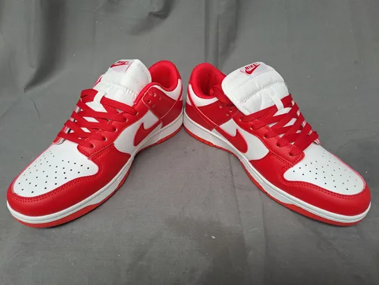 BOXED PAIR OF NIKE TRAINERS IN RED/WHITE UK SIZE 7