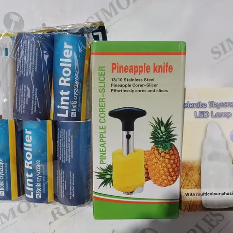 BOX OF APPROXIMATELY 15 ASSORTED HOUSEHOLD ITEMS TO INCLUDE PINEAPPLE KNIFE, SELENITE SKYSCRAPER LED LAMP, LINT ROLLER, ETC