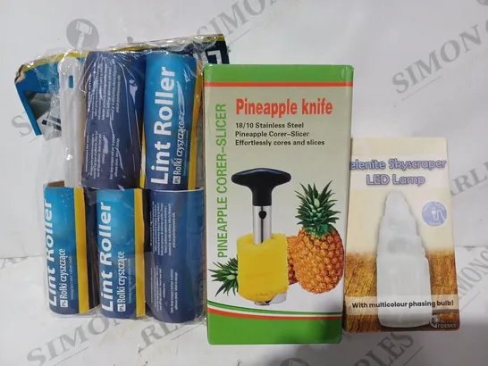 BOX OF APPROXIMATELY 15 ASSORTED HOUSEHOLD ITEMS TO INCLUDE PINEAPPLE KNIFE, SELENITE SKYSCRAPER LED LAMP, LINT ROLLER, ETC