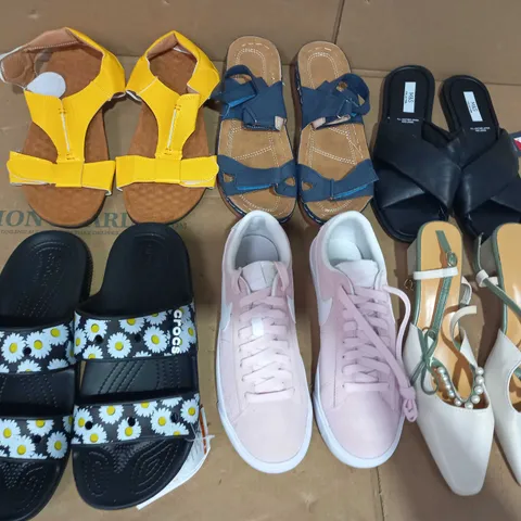 BOX OF APPROXIMATELY 20 ASSORTED FOOTWEAR ITEMS TO INCLUDE CROCS DAISY PRINT SANDALS IN BLACK SIZE UNSPECIFIED, DESIGNER TRAINERS IN THE STYLE OF NIKE IN PINK UK SIZE 4, M&S FAUX LEATHER SANDALS IN BL