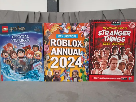 BOX OF APPROXIMATELY 10 ASSORTED BOOKS TO INCLUDE LEGO HARRY POTTER 2023 YEARBOOK, ROBLOX 2024 ANNUAL, GUIDE TO STRANGER THINGS 2024 EDITION, ETC