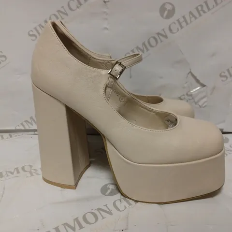 PAIR OF KOI DESIGNER VEGAN STRAP-UP PLATFORM HEELS IN CREAM - SIZE 6