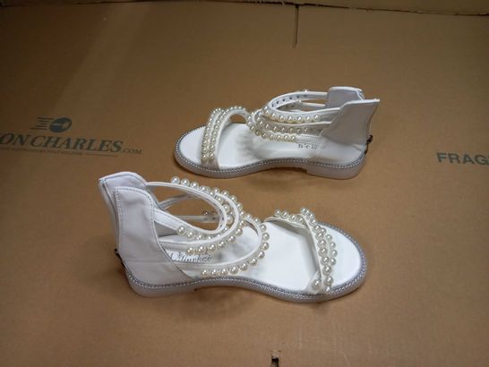 PAIR OF DESIGNER IVORY/PEARL DETAILED ANKLE SANDALS - SIZE 3