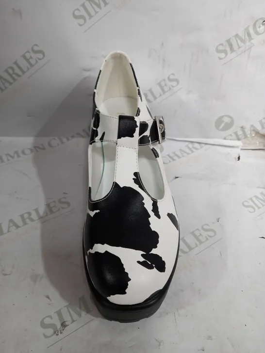 PAIR OF KOI VEGAN LEATHER LOW HEEL BUCKLE STRAP SHOES IN A COW PRINT DESIGN - SIZE 5