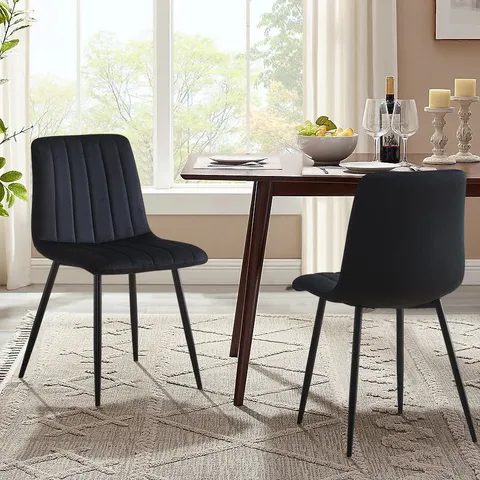 A BOXED PAIR OF BLACK VELVET UPHOLSTERED DINING ROOM CHAIRS 