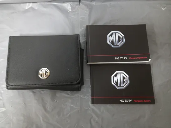 MG OWNERS BOOK AND NAVIGATION SYSTEM BOOK AND WALLET 