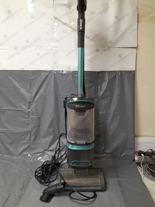 BOXED SHARK UPRIGHT CORDED VACUUM WITH ANTI-HAIR WRAP, LIFTAWAY TECHNOLOGY AND COMPLETE SEAL NZ690UK RRP £249