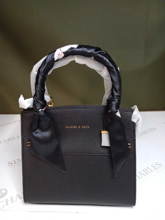 CHARLES AND KEITH ZIPPED LEATHER HANDBAG 